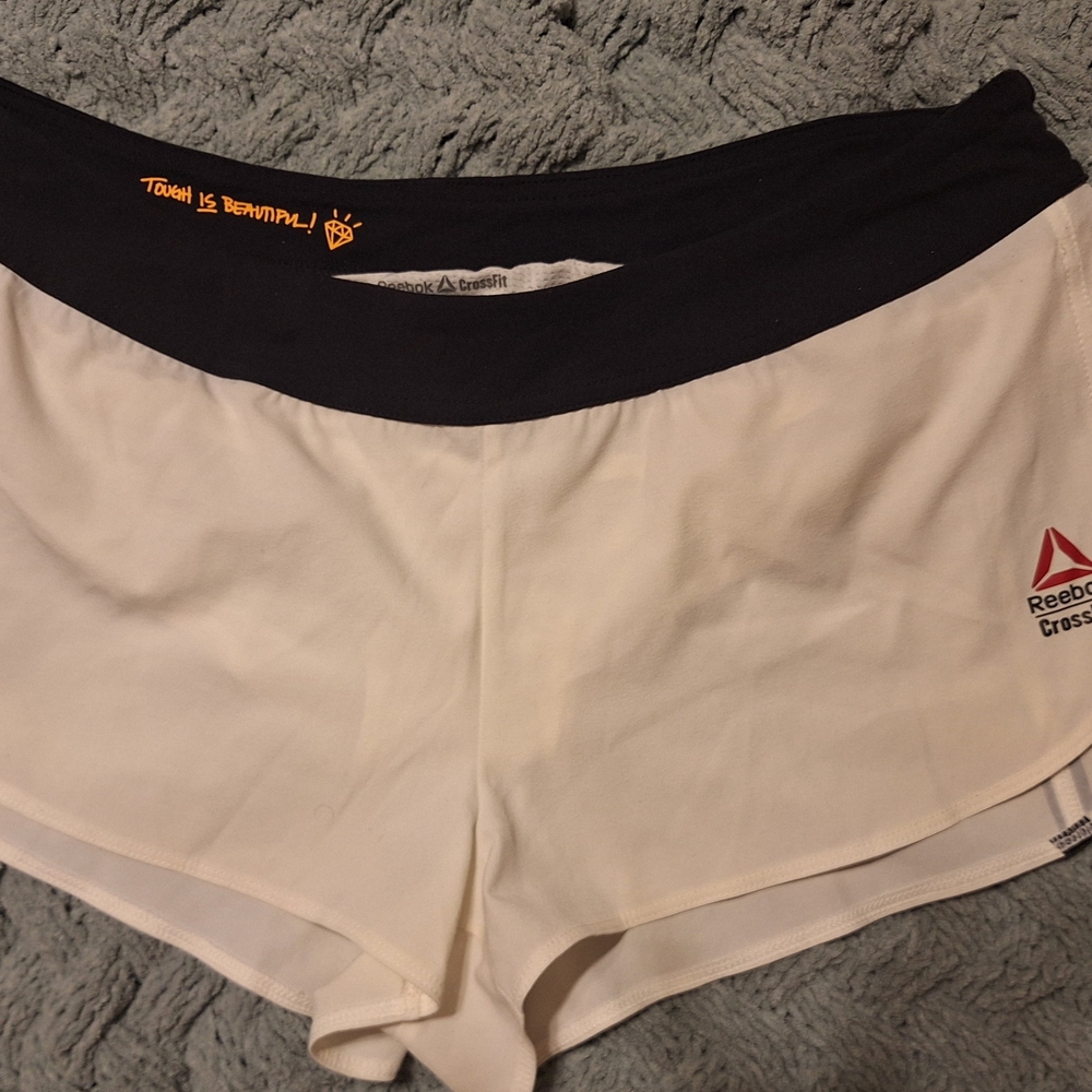 Reebok Women's White Athletic Shorts with Black Waistband and Red Logo